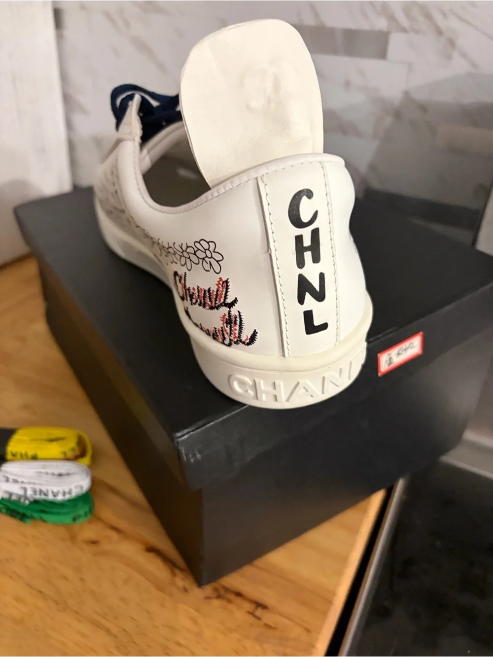 CHANEL White Kids Sneakers with Red and Navy Graphic Accents